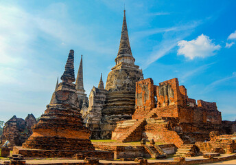 Fototapeta premium The ruins of the old temple. Historical and cultural ancient architecture in Ayutthaya historical park. Ayutthaya, Thailand