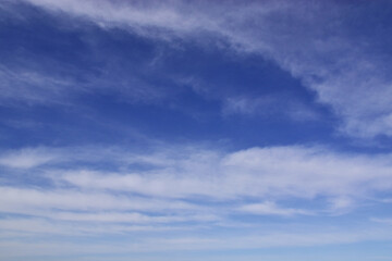 Cirrostratus clouds in the blue spring sky.