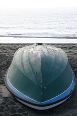 Overturned boat on the beach