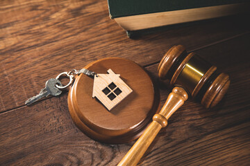 house key with judge and law book