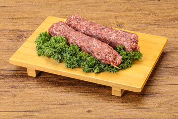 Raw minced beef kebab skewer
