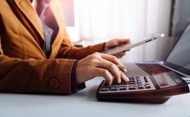 bookkeeper using calculator counting finances taxes fees accounting calculate bills money planning...