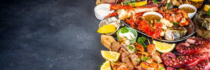 Assortment various barbecue Mediterranean grill food - fish, octopus, shrimp, crab, seafood, mussels, summer diet bbq party fest, with kebab, sauces, black concrete background, above copy space