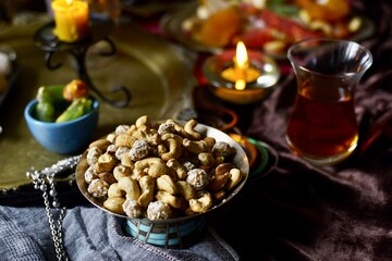 Plate with mix nuts on a eastern styled table