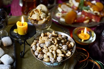 Plate with mix nuts on a eastern styled table