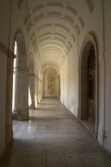 Strolling under the arcades of the abbey - 431379928