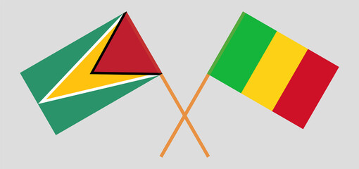 Crossed flags of Guyana and Mali. Official colors. Correct proportion