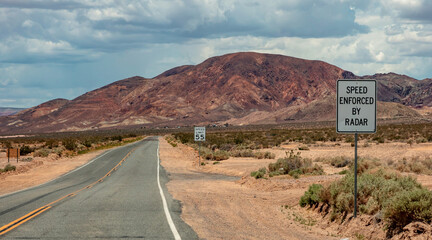 Speed limit signs in Nevada, USA. cloudy sky background