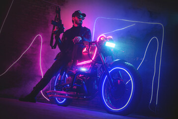 Naklejka na ściany i meble A special force agent with a rifle on a futuristic motorbike. Cyberpunk concept.
