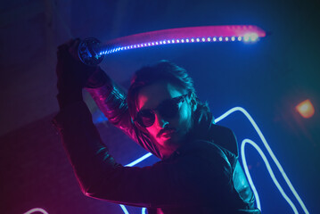A cyberpunk soldier with a katana sword in the neon lights. Futuristic warrior concept.