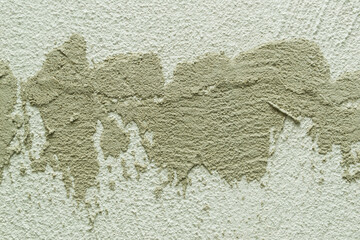 Concrete background. Plaster on the wall. Embossed textured surface.