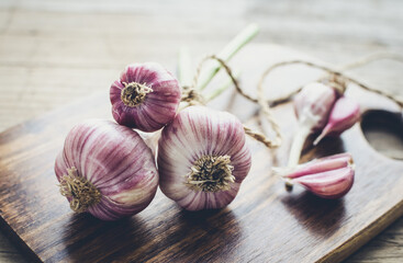 Rustic style garlic on vintage wooden background
