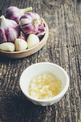Rustic style garlic on vintage wooden background