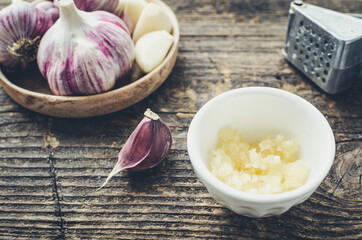 Rustic style garlic on vintage wooden background