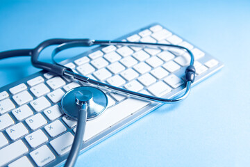 Stethoscope on a computer keyboard