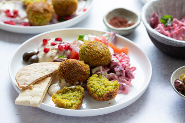 Middle eastern spread with falafel, olives and beetroot salad