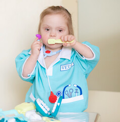 Down syndrome in a little girl dressed as a doctor, a disabled child plays role-playing games,...
