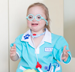 Down syndrome in a little girl dressed as a doctor, a disabled child plays role-playing games,...
