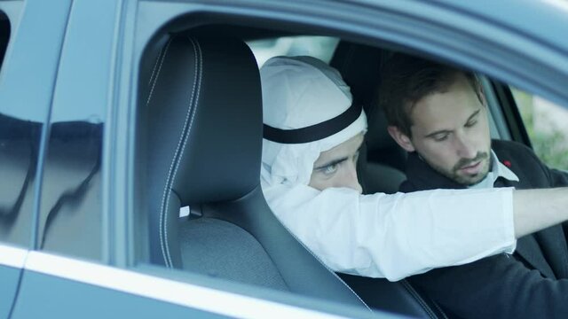 The sheik tells the driver where to go.