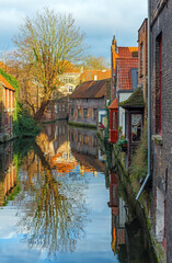 Fototapeta premium Vertical historic city center of Bruges with canals and medieval architecture, Belgium. 