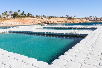 pontoon with a swimming pool on the Red Sea coast. Pontoon and beach without people. quarantine 