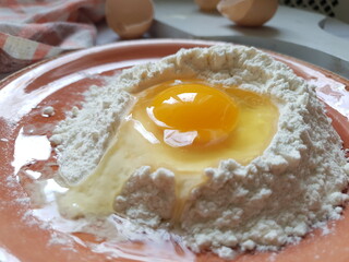 egg in flour. dough preparation