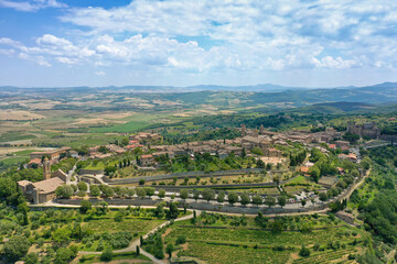 Fototapeta na wymiar aerial view of the medieval town of montalcino with the surrounding vineyards on the hills in the hills in the province of Siena