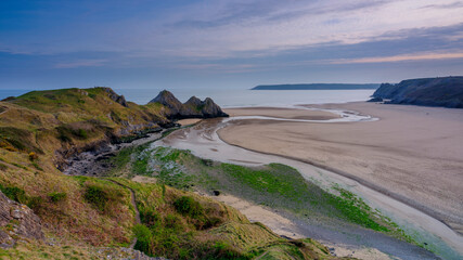 Sunset over Three Cliffs Bay, Gower Peninsula, Wales, UK