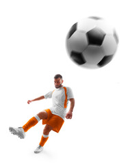 Professional soccer. Player kicks the ball on the soccer field. Isolated