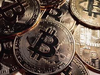 Golden bitcoin background, bitcoin is most popular crypto currency with copy space