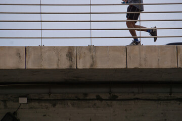boy running and doing sports on a bridge