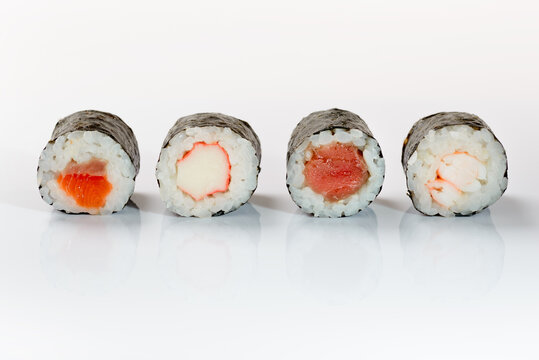 Four sushis on a white background.