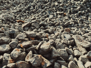 Gray texture of many large sharp hard gray stones, rubble, gravel. The background. Texture