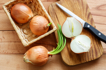 Sliced onion on a wooden cutting board