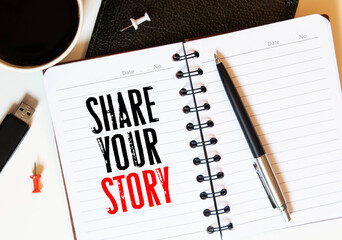 Share your story written on the paper on a wood background