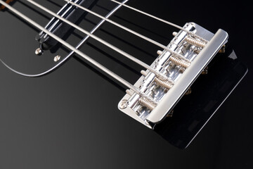 black bass guitar on black background