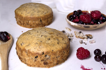 sweet baked pastry food with plate of fruits. Tasty home made cake flavored with cinnamon and spices.