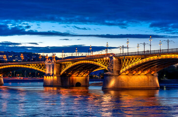 Obraz na płótnie Canvas Night Budapest, Margit Bridge over the Danube River, reflection of night lights on the water