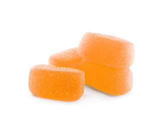Tasty orange jelly candies on white background