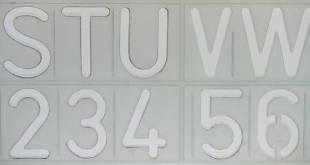 STUVW 234 56 alphabetical stencil on a white backlit surface