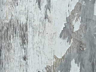 peeling white paint flaking off old country farm barn building wall closeup