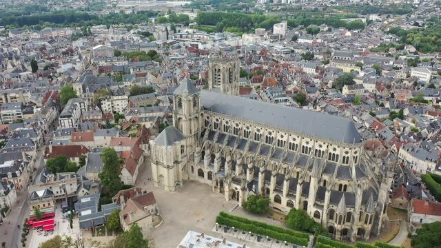 View from drone of houses and ancient Roman Catholic Cathedral of Bourges town at summer day, France