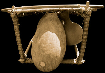 African musical instrument made from a fruit on black background. Senegal
