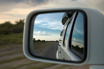 Fototapeta na wymiar Mirror and african view while driving in Nambia - Kaokoland
