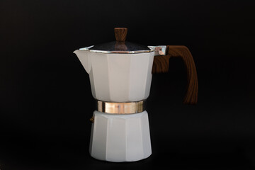 Italian moka pot isolated on black background