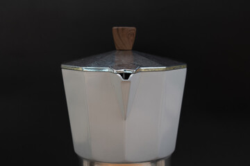 Italian moka pot isolated on black background