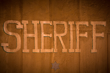Sheriff Office sign on wood background. Law symbol on wild west USA found at the Monument Valley. Retro style image.