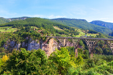 Fototapeta na wymiar Durdevica Tara Bridge famous place in Montenegro . Biggest Canyon in Europe in the national park Durmitor Montenegro
