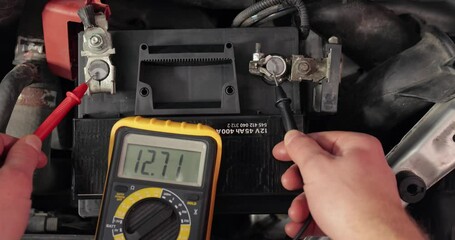 Checking car battery and alternator voltage with running engine