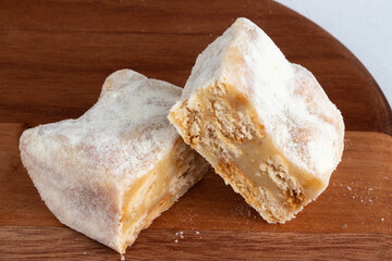 Close up of delicious Italian straw (palha italiana) on cutting board.